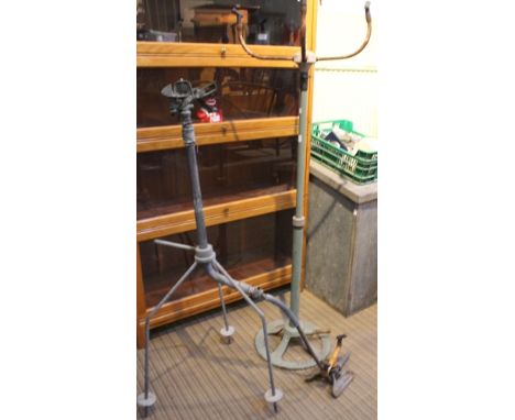 Three vintage garden lawn sprinklers including a Cooper Stuart example