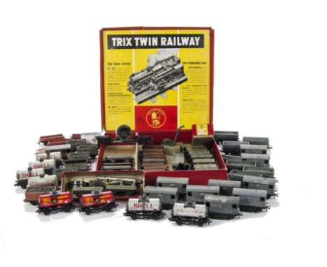 Twin Trix 00 Gauge Metal and Plastic bodied Rolling Stock; including Ore Wagons (8+ spares) Guards Vans with light (9), Tanke