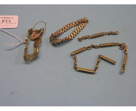 Two 9ct. gold bracelets, one gate-link with padlock clasp, 30.7 grams total, and a yellow metal link chain, 21.9 grams, part-
