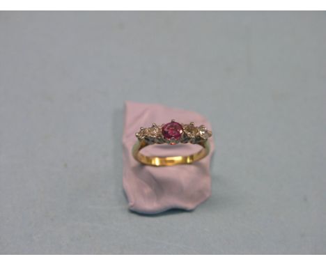 An 18ct. gold half-hoop ring, four diamonds, single ruby, claw setting, size K/L 