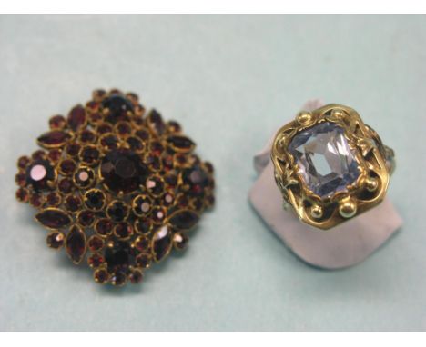 A 14ct. gold dress ring, step-cut aquamarine within carved setting, size N, together with a Victorian garnet brooch