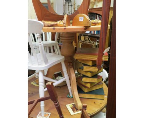 A pine breakfast table, circular top on tripod pedestal stem, 3ft., and a set of four wicker-effect dining chairs with vinyl 