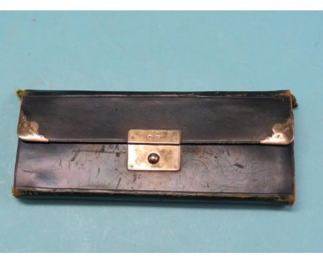 A late Victorian silver-mounted leather needlework set, folding in sections, with tools and silks, retailer J. Bagshaw, Liver