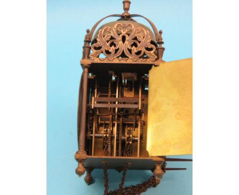 An old reproduction lantern clock,  6.5in. brass dial signed Thos. Moore, Ipswich, chain drive with pendulum and weight 