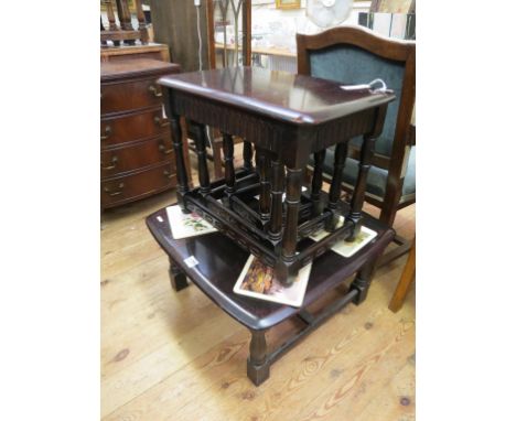 An Ercol-type dark oak nest, three tables, and a matchng coffee table