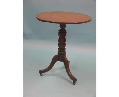 A Victorian oak tripod table, circular top on turned stem, unusual with casters, 2ft.