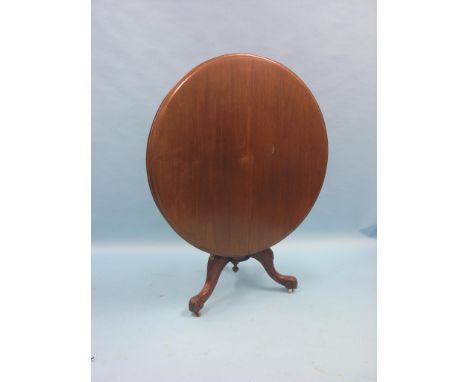 A Victorian mahogany tilt-top breakfast table, circular top on turned pedestal stem and carved tripod base, 3ft. 4in. diamete