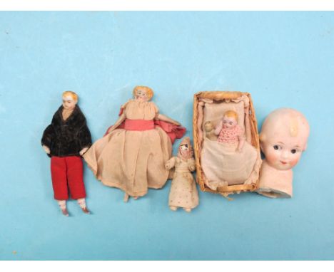 A pair of late 19th century German shoulder dolls, fully-clothed, two kewpie-type seated dolls, and five other miniature cera