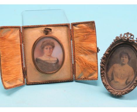 A Victorian portrait miniature on ivory, lady wearing sapphire necklace, together with a portrait photograph, same sitter, in