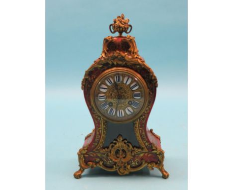 A 19th century boullework mantel clock, brass dial with enamelled numerals, French movement striking on a bell, ormolu-mounte