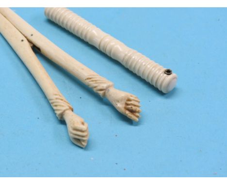 A pair of Victorian carved bone glove-stretchers, another pair, bone Stanhope needle case and a pickle fork with carved bone 