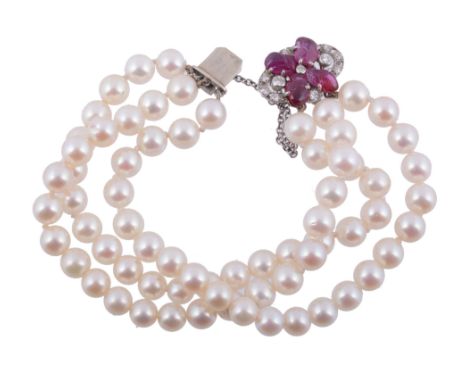  A cultured pearl bracelet with a diamond and ruby clasp  , the three rows of uniform cultured pearls to an oval clasp set wi