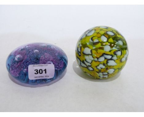 A Caithness paperweight and a Mdina example