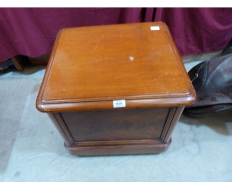 A Victorian mahogany commode with ceramic liner and folding arms