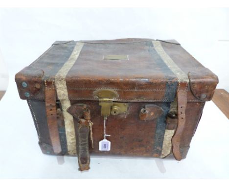 A 19th century leather carriage trunk, the lid bearing a nameplate for Lord Ormathwaite, 19' wide. Distressed. (The title was