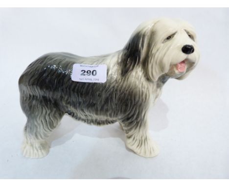 A ceramic model of an old English sheepdog. 7' high