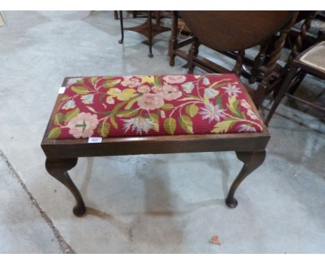 An oak duet stool with tapestry seat