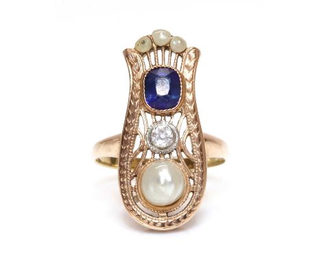 A Continental rose gold sapphire, diamond and pearl ring, c.1915,with an urn shaped pierced head. A cushion cut sapphire, mil