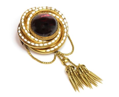 A Victorian gold garnet and enamel brooch, with a circular cabochon garnet rub set with twisted wire decoration to the centre