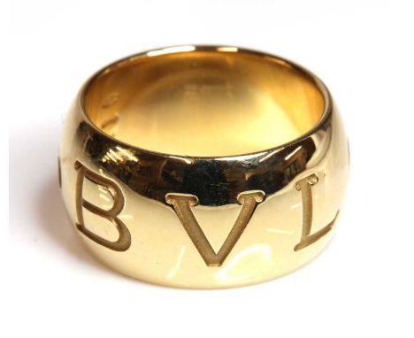 An 18ct gold 'Monologo' ring, by Bulgari,with the recessed Bvlgari name to a 'D' section band. Marked made in Italy. 10mm wid