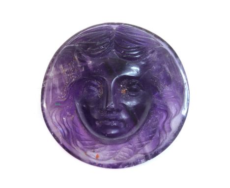 An unmounted circular carved amethyst cameo,depicting a lady with a snake or serpent around her neck. 12.90 x 12.80mmProvenan