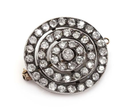 A late Victorian diamond set target brooch/pendant, c.1890,with an old European cut diamond, rub set to the centre, with thre