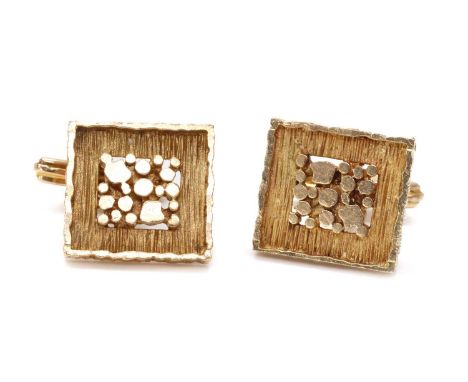 A pair of 9ct gold swivel link cufflinks, by H. Samuel, c.1970,of rectangular form. A series of graduated rods to the centre,