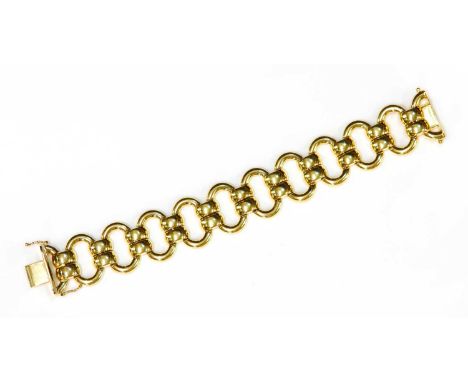 An Italian 14ct gold hollow oval link bracelet,with pairs of domed bridge links between. A concealed box clasp with a figure 