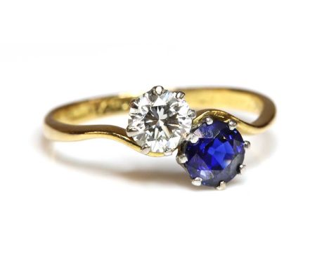 A sapphire and diamond crossover ring, with a brilliant cut diamond, estimated as approximately 0.55ct, and a round mixed cut