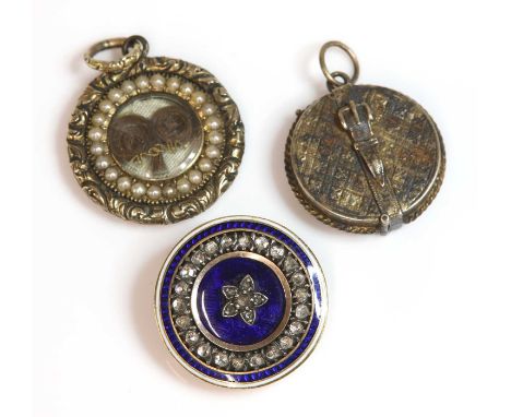 A Georgian diamond and enamel circular target form brooch, c.1790,previously a clasp, with a rose cut diamond set cluster to 