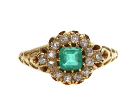 A late Victorian emerald and diamond cluster ring,with a square emerald cut emerald, claw set to the centre. A border of cush