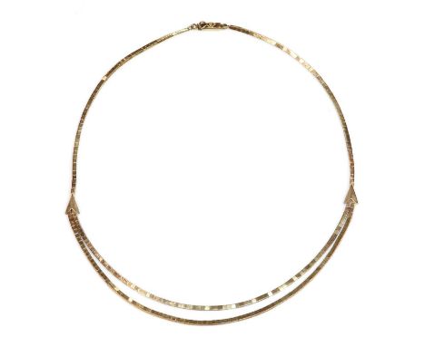 A Continental two strand necklace,possibly German, with square section wrapped strands with arrow head motifs and a box clasp