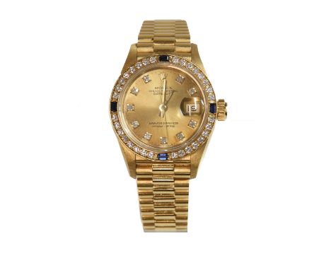 A ladies' 18ct gold Rolex 'Oyster Perpetual Datejust' automatic bracelet watch, c.1990,with a sapphire and diamond set bezel.