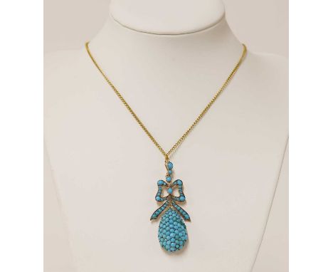 A Victorian gold turquoise pendant,with a pear shaped bombé drop pavé set with round cabochon turquoise, surmounted by a ribb