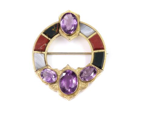 A Scottish gold hardstone brooch,of circular form, with keystone shaped specimens of agate, jasper and bloodstone, inlaid int