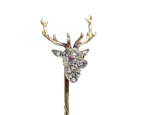 A diamond set stag head stick pin,with rose cut diamonds pavé set to the stag head, with cabochon ruby eyes, all set in silve