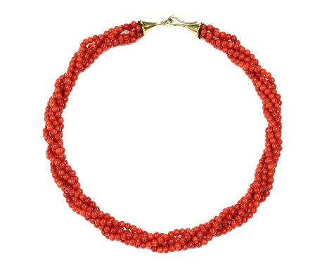 A five row carved coral bead torsade necklace, by Clare Murray, with uniform 4mm beads, strung plain to conical end caps, wit