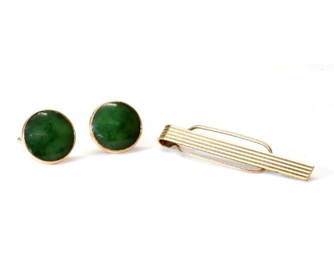 A pair of gold nephrite jade swivel cufflinks, c.1970,with a circular nephrite jade cabochon, rub set to a backplate with swi