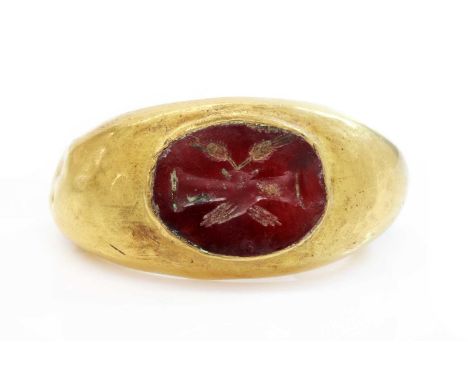 A Roman hollow gold hardstone intaglio ring,possibly 3rd century, with an oval flat hardstone tablet, intaglio engraved with 