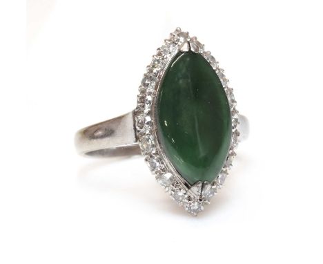 A nephrite jade and diamond marquise shaped cluster ring,with a marquise shaped cabochon jade, chevron claw set to the centre