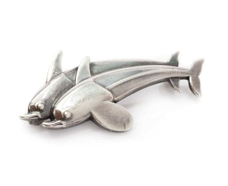 A sterling silver dolphin 'Hawaii' brooch, by Georg Jensen,no. 317, designed by Arno Malinowski. Marked sterling Denmark, mak