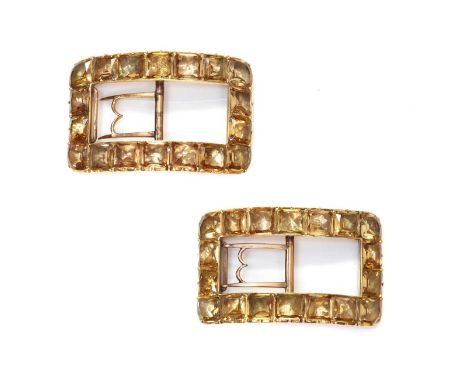 A pair of George III gold mounted topaz shoe buckles, c.1790,with a series of cushion cut foil backed topaz, all set in cut d