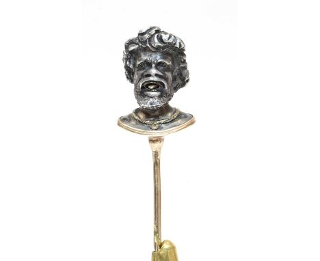 A Victorian silver and gold stick pin,depicting the head of a bearded gentleman with an open mouth and a gold tongue protrudi