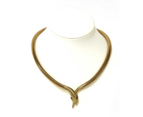 A 9ct gold sprung snake or serpent necklace,composed of circular section gas pipe. A crossover snake head and tail centrepiec