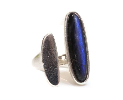 A sterling silver labradorite ring, by Georg Jensen,no. 172, designed by Bent Gabrielsen. Of torque form, with an elongated o