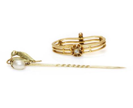 An Art Deco pearl stick pin,in the form of a naturalistic snow drop, with an oval fully drilled pearl, untested, peg set to t