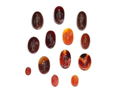 Thirteen oval agate intaglios,each one depicting a standing female figure in 19th century costume, holding scales, a cornucop