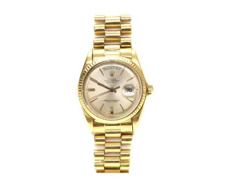 A gentlemen's 18ct gold Rolex 'Oyster Perpetual' automatic day date bracelet watch 1803, c.1973,with a 36mm case, a champagne