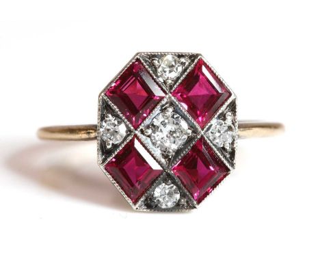 An Art Deco diamond and synthetic ruby plaque ring, with an octagonal head. A diagonal grid design with a brilliant cut diamo