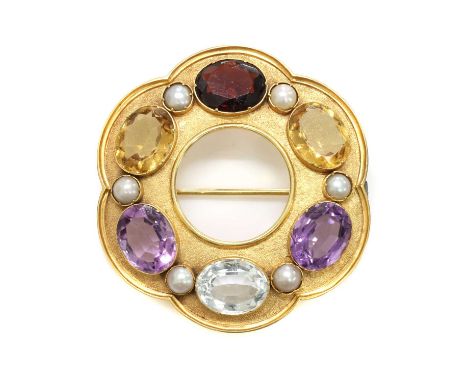 A Victorian gold gemstone set hexafoil circle brooch,with an open centre. A series of oval mixed cut amethysts, citrines, a g